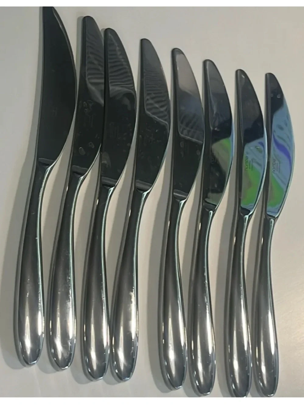 Set of 8 nambe Bend stainless table knives EUC